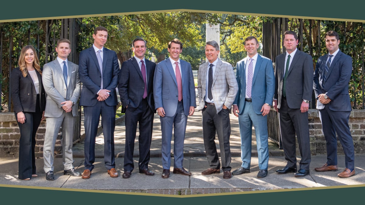 The Yarborough Applegate team stand in a line for a group photo outside. The six attorneys who were recently named South Carolina Super Lawyers are among them.
