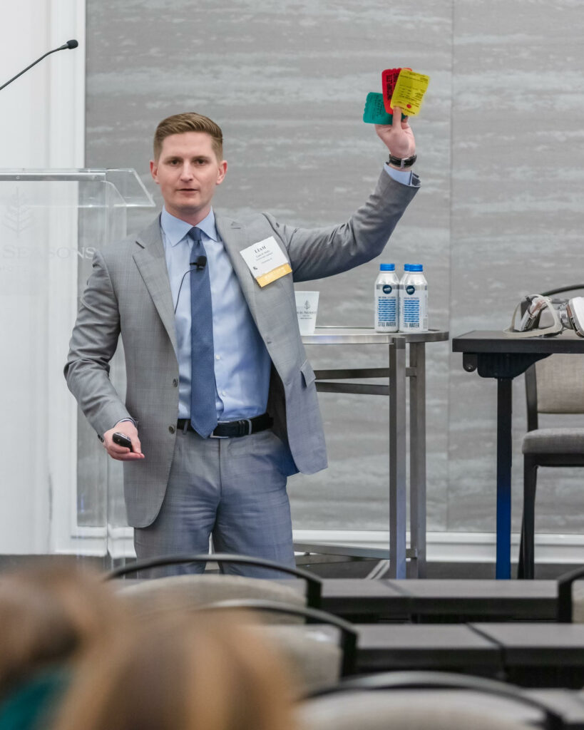 Yarborough Applegate attorney Liam Duffy holds up colored scaffold cards as part of his presentation.
