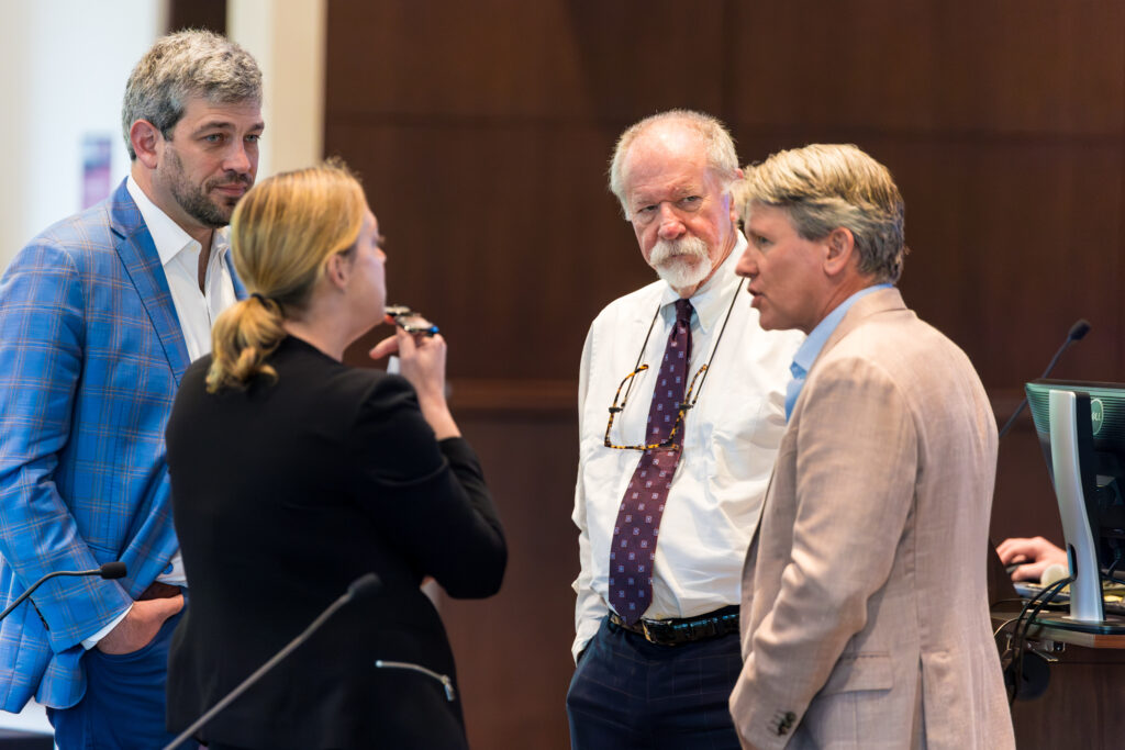 A group of people, including attorney David Yarborough, converse during SCAJ's Young Lawyers Symposium